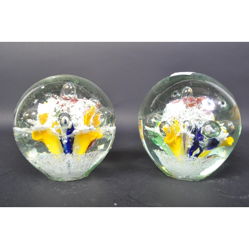 791 - A pair of Victorian 19th century Nailsea glass paperweight dumps with polychrome floral decoration w... 