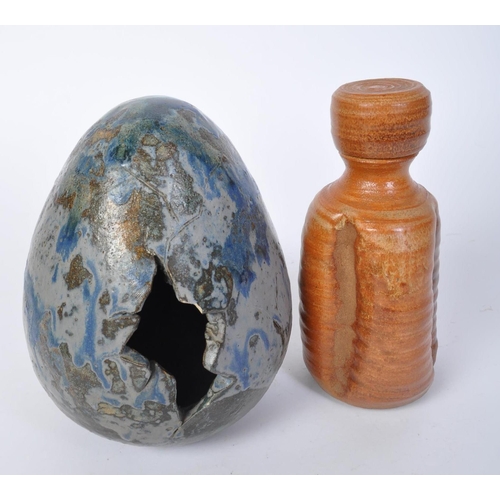 794 - A vintage 20th Century stoneware pottery artwork in the form of an egg. The egg of typical form with... 