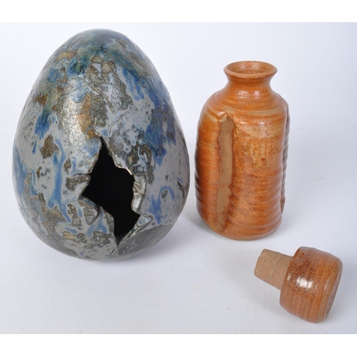 794 - A vintage 20th Century stoneware pottery artwork in the form of an egg. The egg of typical form with... 