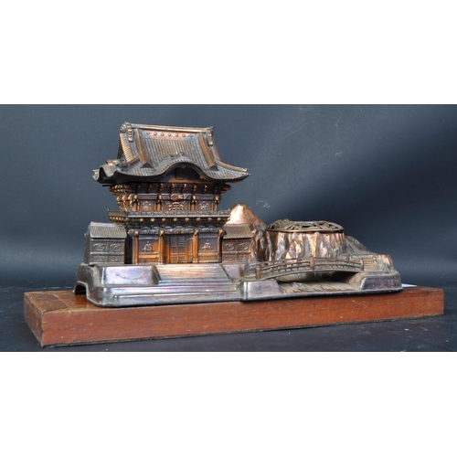 805 - A mid 20th century post WWII Japanese copper musical box/smokers companion, in the form of a pagoda ... 