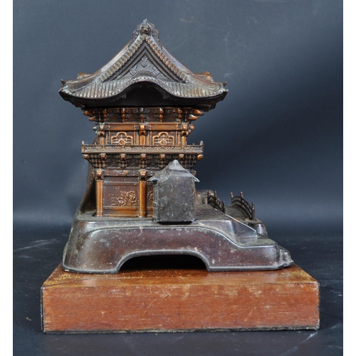 805 - A mid 20th century post WWII Japanese copper musical box/smokers companion, in the form of a pagoda ... 