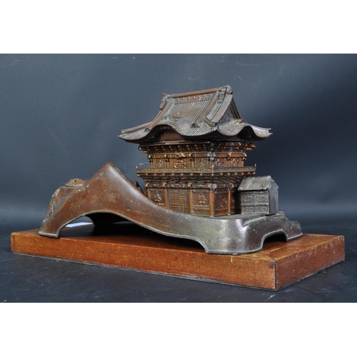 805 - A mid 20th century post WWII Japanese copper musical box/smokers companion, in the form of a pagoda ... 