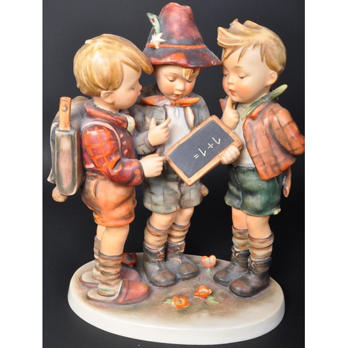 697 - A 20th century Western German Goebel porcelain figure group of School Boys. Model No 170 with markin... 