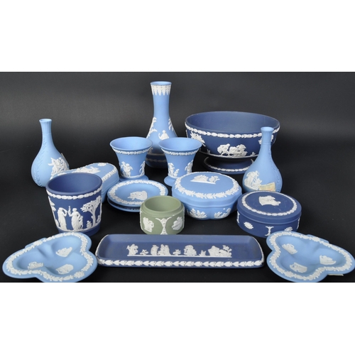 698 - A collection of Wedgwood blue and white jasperware - cameo ware. To include fruit bowl, pin dishes, ... 