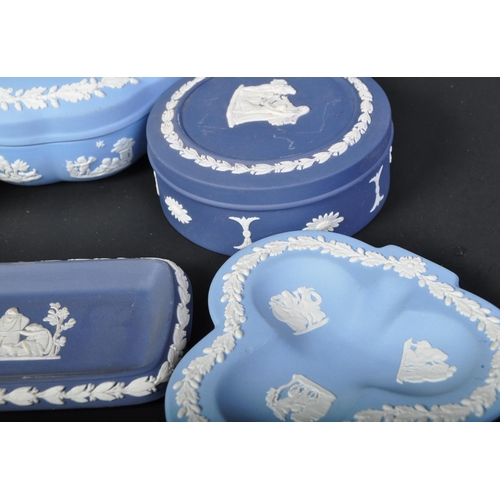 698 - A collection of Wedgwood blue and white jasperware - cameo ware. To include fruit bowl, pin dishes, ... 