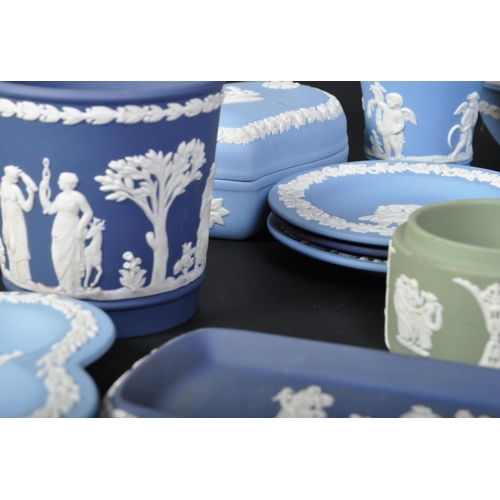 698 - A collection of Wedgwood blue and white jasperware - cameo ware. To include fruit bowl, pin dishes, ... 