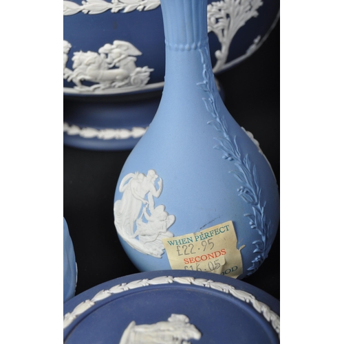 698 - A collection of Wedgwood blue and white jasperware - cameo ware. To include fruit bowl, pin dishes, ... 