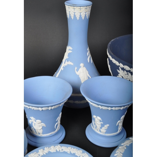 698 - A collection of Wedgwood blue and white jasperware - cameo ware. To include fruit bowl, pin dishes, ... 