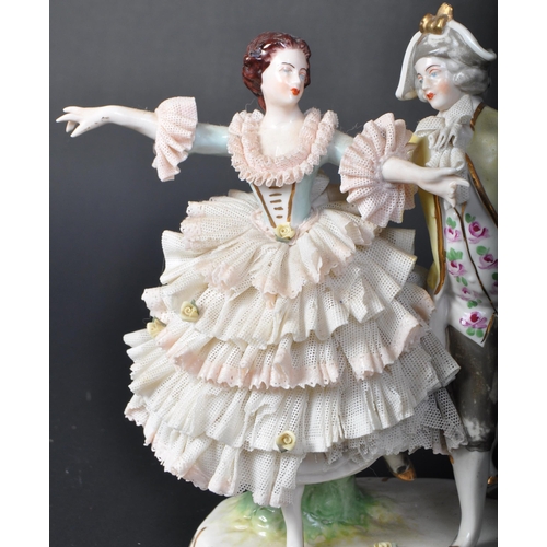 707 - An assortment of 20th century Dresden German porcelain lace figurines comprising of a couple dancing... 