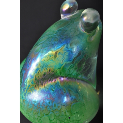 712 - A vintage 20th century John Ditchfield for Glasform iridescent glass frog shaped paperweight in a gr... 