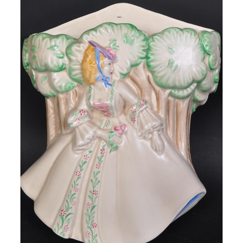 760 - A mid 20th century circa 1938 Clarice Cliff 'Lady Anne' wall pocket. Modelled as a lady in crinoline... 