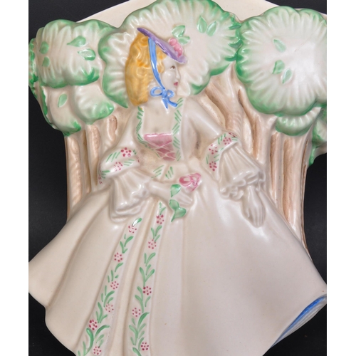 760 - A mid 20th century circa 1938 Clarice Cliff 'Lady Anne' wall pocket. Modelled as a lady in crinoline... 