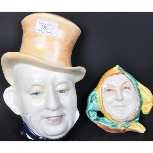 765 - Two 20th century Beswick Ware ceramic wall plaques. The lot comprising of a large man head shaped wa... 