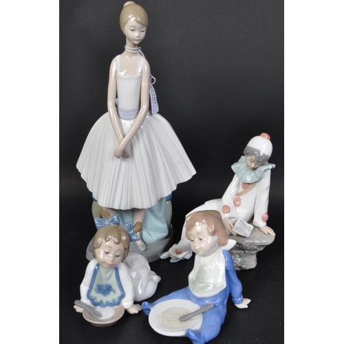 767 - An assortment of vintage 20th century Nao by Lladro Spanish porcelain figurines. The lot to include ... 