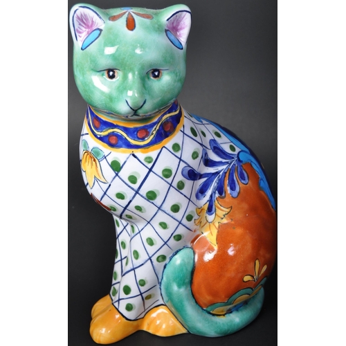 726 - A collection of vintage 20th century bone china cat figures to include an oversized imari cat, two L... 