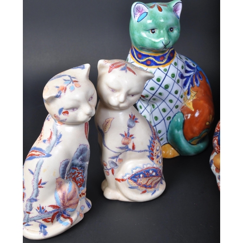 726 - A collection of vintage 20th century bone china cat figures to include an oversized imari cat, two L... 