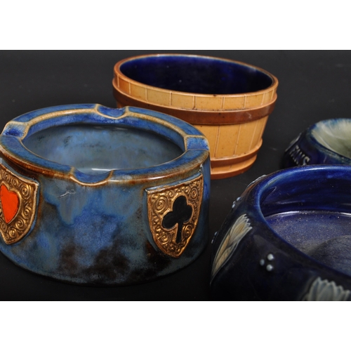 691 - Four early 20th century Royal Doulton Lambeth pottery ashtrays. The lot to include a Royal Doulton X... 