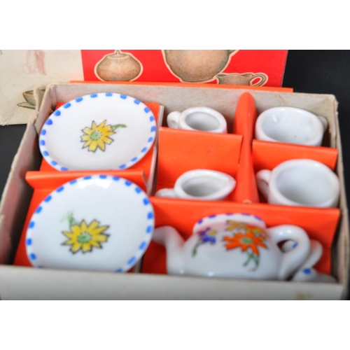 692 - A retro vintage mid 20th Century toy child's china tea service set. With teapot, two saucers and cup... 