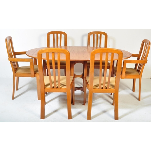 1157 - A retro vintage 20th century teak wood dining suite. The lot to include a teak wood drop leaf dining... 