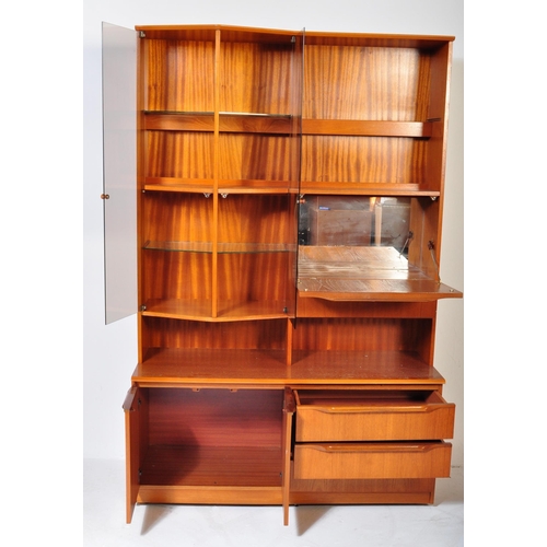 1162 - A retro vintage 20th century teak wood display cabinet / wall unit having a straight top over a glaz... 