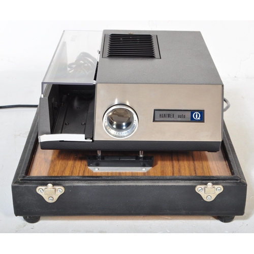 1166 - A mid 20th Century oak wood projector case being hand made with sectional top enclosing a Hanimex au... 