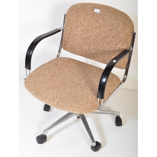 1177 - A vintage retro mid 20th century swivel office chair. The chair having back rest and seat upholstere... 