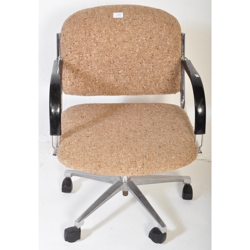 1177 - A vintage retro mid 20th century swivel office chair. The chair having back rest and seat upholstere... 