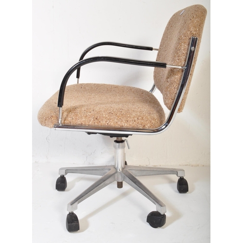 1177 - A vintage retro mid 20th century swivel office chair. The chair having back rest and seat upholstere... 