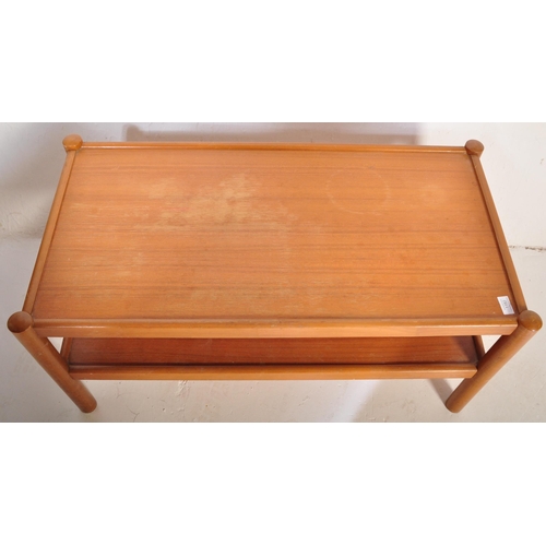 1182 - A vintage retro mid 20th century teak coffee table having rectangular under tier over cylindrical su... 