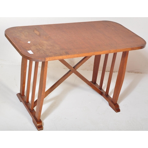 1188 - A vintage retro mid 20th century teak side table having a rectangular top with trestle type base uni... 