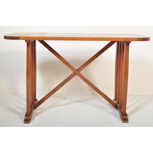 1188 - A vintage retro mid 20th century teak side table having a rectangular top with trestle type base uni... 