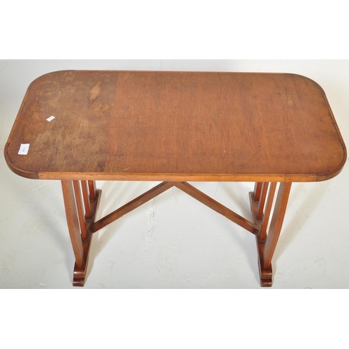 1188 - A vintage retro mid 20th century teak side table having a rectangular top with trestle type base uni... 