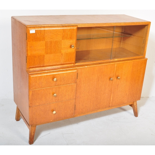 1191 - Beautility - A vintage retro mid 20th century teak sideboard. The sideboard having a glazed sliding ... 