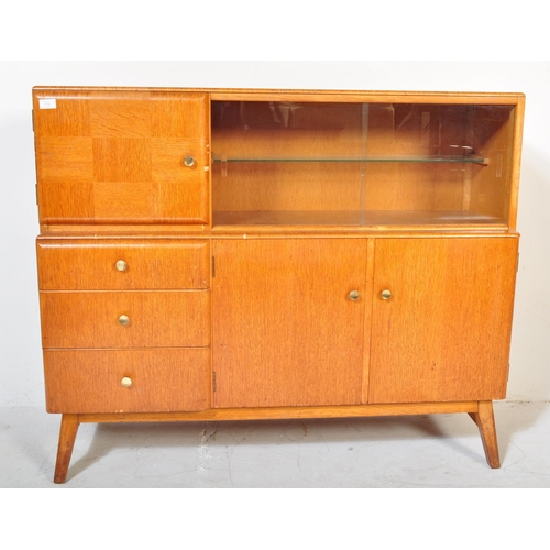 1191 - Beautility - A vintage retro mid 20th century teak sideboard. The sideboard having a glazed sliding ... 