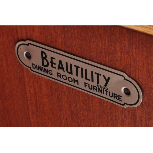 1191 - Beautility - A vintage retro mid 20th century teak sideboard. The sideboard having a glazed sliding ... 