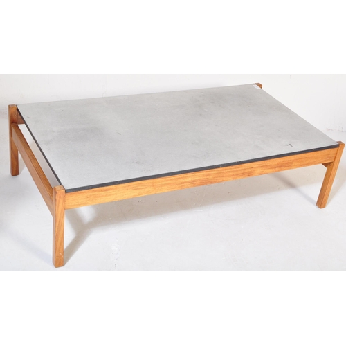 1193 - A vintage retro mid 20th century coffee table having a faux marble top suspended over squared teak s... 