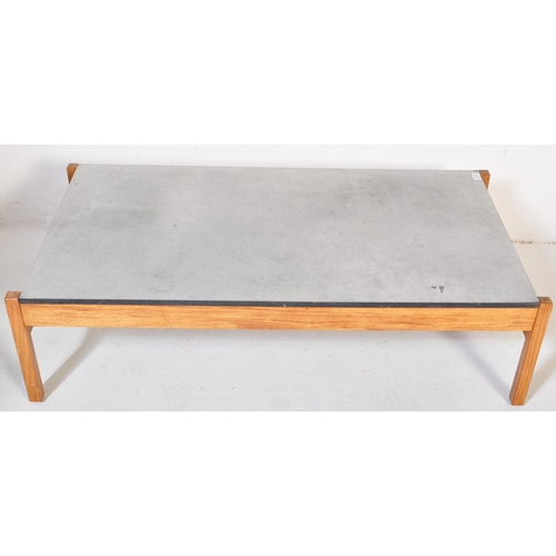 1193 - A vintage retro mid 20th century coffee table having a faux marble top suspended over squared teak s... 