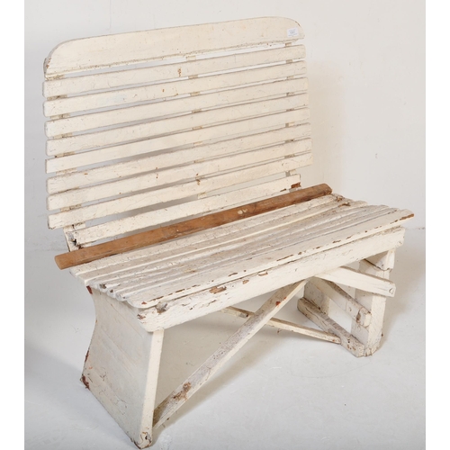 1201 - An early 20th century circa. 1920's railway train station bench constructed from painted white woode... 