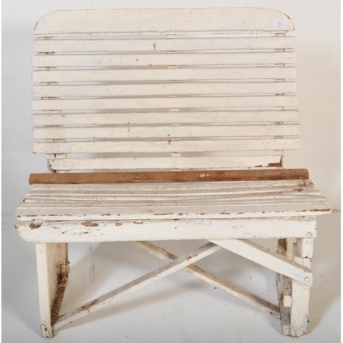 1201 - An early 20th century circa. 1920's railway train station bench constructed from painted white woode... 