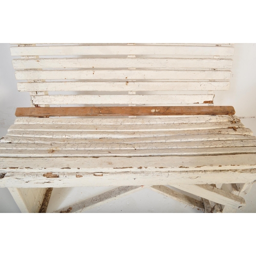 1201 - An early 20th century circa. 1920's railway train station bench constructed from painted white woode... 