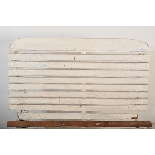 1201 - An early 20th century circa. 1920's railway train station bench constructed from painted white woode... 