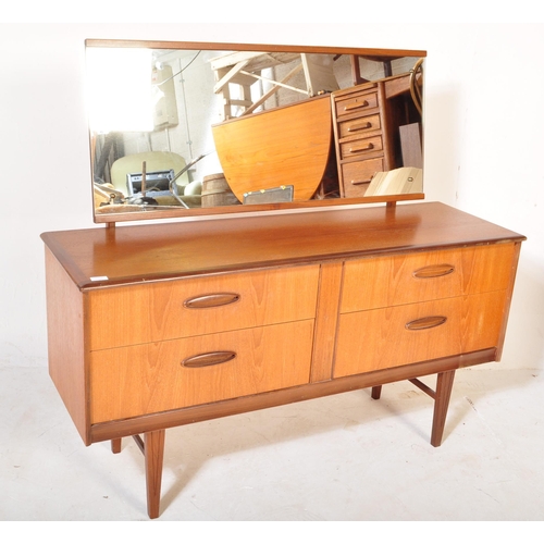 1205 - A Mid century teak wood Dressing table in the manner of Frank Guille for Austinsuite. Raised on tape... 