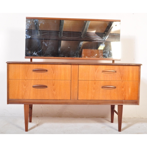 1205 - A Mid century teak wood Dressing table in the manner of Frank Guille for Austinsuite. Raised on tape... 