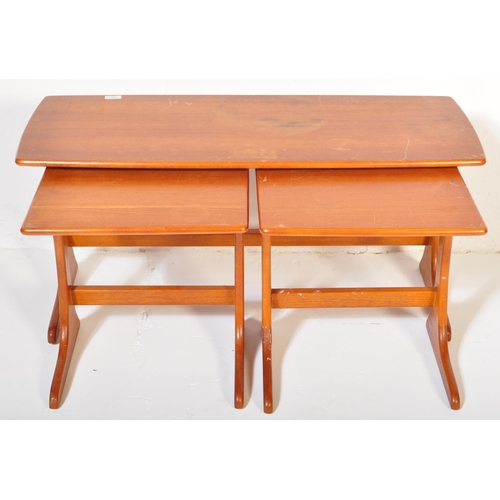 1207 - A mid century teak wood nest of tables. Each with graduating tops having shaped and splayed legs uni... 