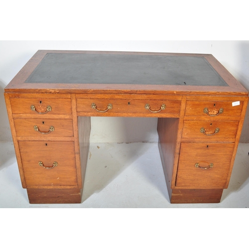 1208 - A mid century, circa 1960's oak wood twin pedestal office desk in the manner of Air Ministry Furnitu... 