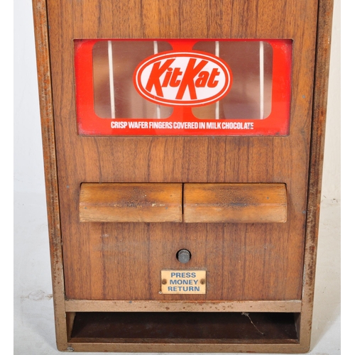 1210 - A retro vintage 20th century wooden Kit - Kat vending machine with two 20p insert. It measures appro... 