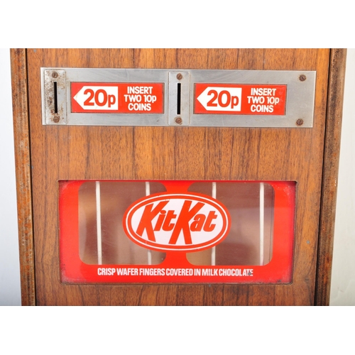 1210 - A retro vintage 20th century wooden Kit - Kat vending machine with two 20p insert. It measures appro... 