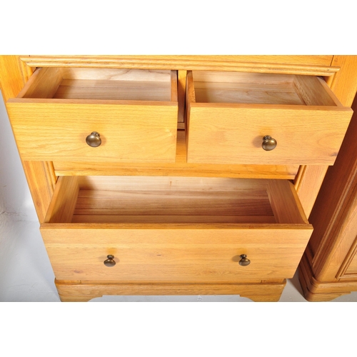 1215 - A pair of contemporary oak furniture land type chest of drawers in the manner of Oak Furniture Land ... 