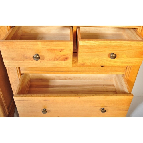 1215 - A pair of contemporary oak furniture land type chest of drawers in the manner of Oak Furniture Land ... 