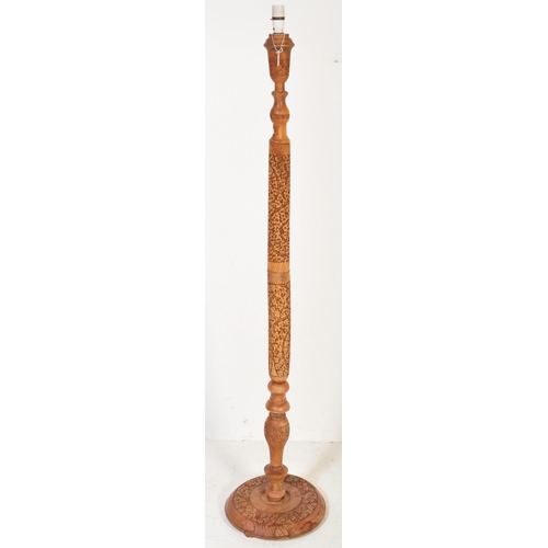 1217 - A mid century Chinese carved hardwood standard lamp raised on carved leaf circular base with carved ... 